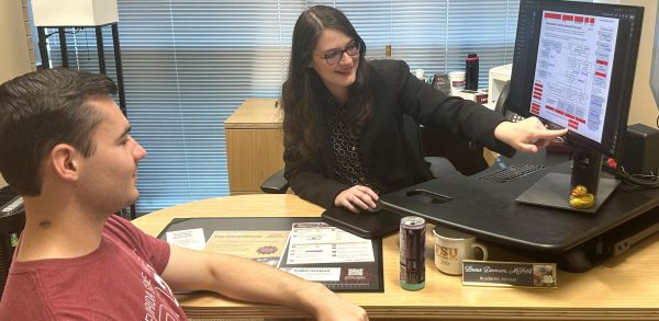 Laura Damren advises a student