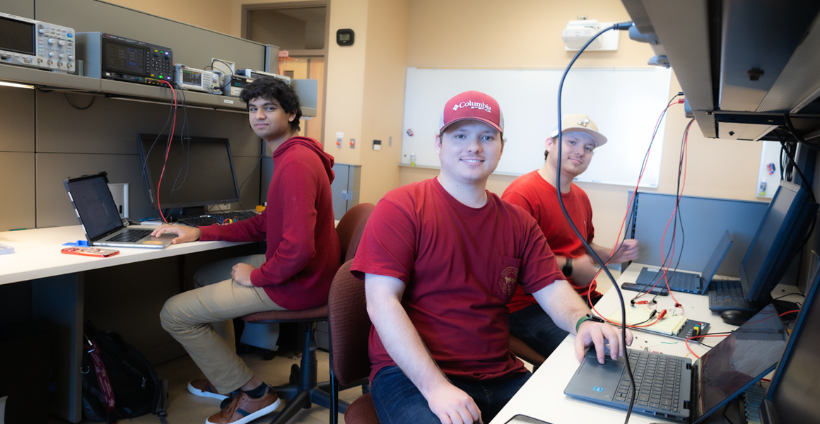 electrical and computer engineering students at workbench