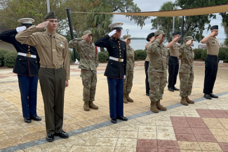 Military science and JROTC students from Bay District Schools compete in a parade drill at FSU Panama City in 2024 as part of the annual Veterans Day event. 