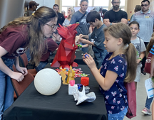 A visitor tries out a virtual reality interface at the inaugural ASCENT Tech Expo at FSU Panama City.