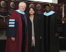 Student robed, then signs Freshmen Book