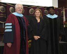 Student robed, then signs Freshmen Book