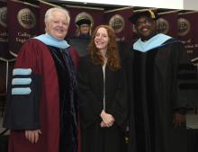 Student robed, then signs Freshmen Book