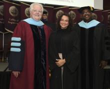 Student robed, then signs Freshmen Book