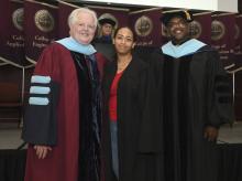 Student robed, then signs Freshmen Book