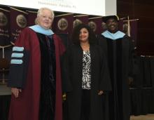 Student robed, then signs Freshmen Book