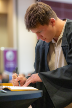 First-Year student signing book 26