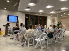 Chris Hasegawa, speaking to the 30A audience about "Your Aging Brain." 